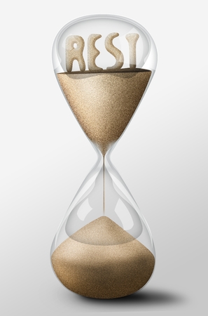 Hourglass with Rest word made of sand inside the clock. Concept of relaxation