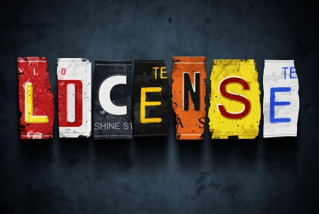 License word on vintage broken car plates, concept signの写真素材