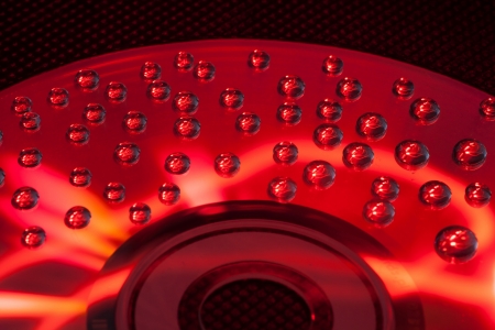 Abstract music background, colorful water drops on CD/DVD discの写真素材