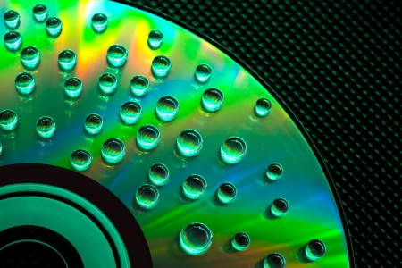 Abstract music background, colorful water drops on CD/DVD discの写真素材