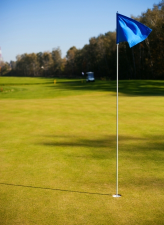 Golf course landscape with green and cupの写真素材