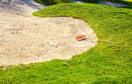 Sand bunker on the golf course with green grassの写真素材
