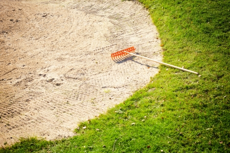 Sand bunker on the golf course with green grassの写真素材