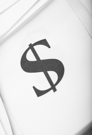 Close up too dollar sign on paper backgroundの写真素材