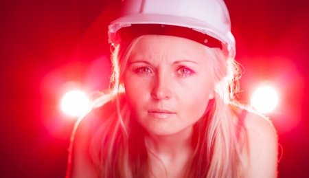 Fashionable young architect woman construction worker, glowing lightsの写真素材