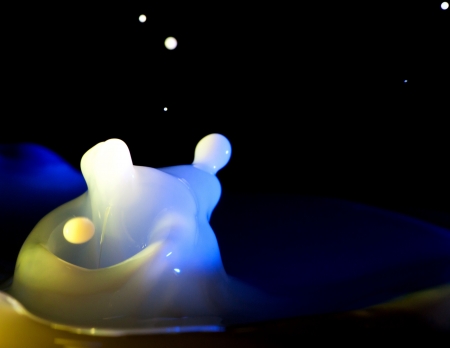 Milk splash, colorful abstract liquid on darkの写真素材