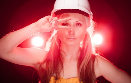 Fashionable young architect woman construction worker, glowing lightsの写真素材