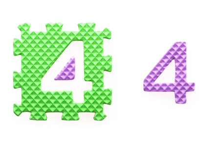 Colored puzzles with number 4 for children. Isolated whiteの写真素材