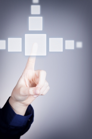 Woman's hand pushing the button on touch screen. Choice conceptの写真素材