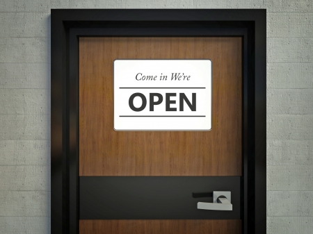 Come in we are open sign hanging on a office doorの写真素材