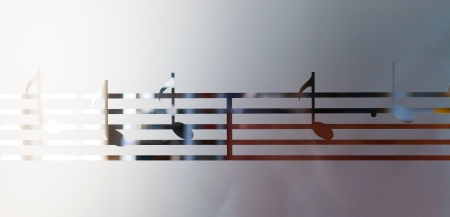 Musical notes on frosted glass, artistic backgroundの写真素材