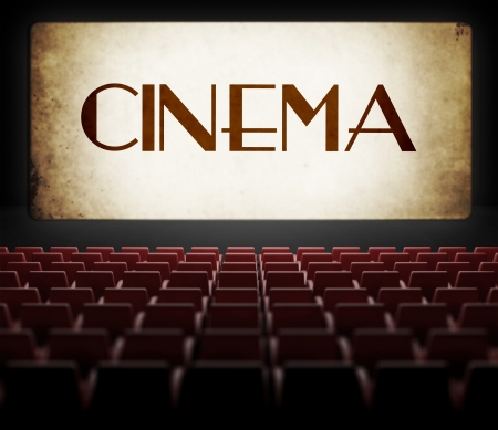 Vintage movie screen in old retro cinema, view from audienceの写真素材