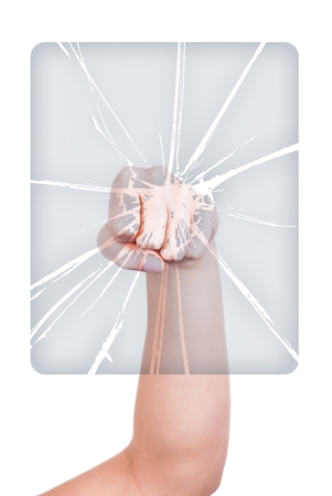 Woman's hand with fist breaking glass isolated whiteの写真素材