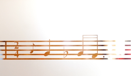 Musical notes on frosted glass, artistic backgroundの写真素材