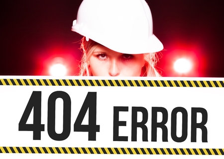 Worker holding 404 error sign placed on information boardの写真素材