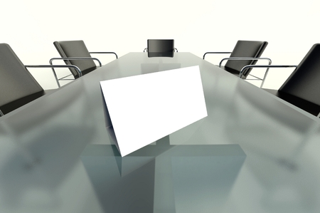 Conference table and blank place card on white backgroundの写真素材