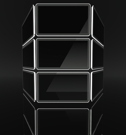 Desktop computer screens on black background with text spaceの写真素材