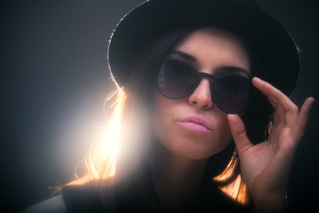 Retro fashion portrait of fashionable stylish young womanの写真素材