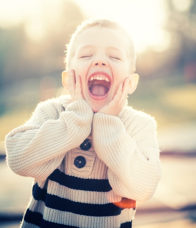 Smiling child, portrait of little boy playing outdoorの写真素材