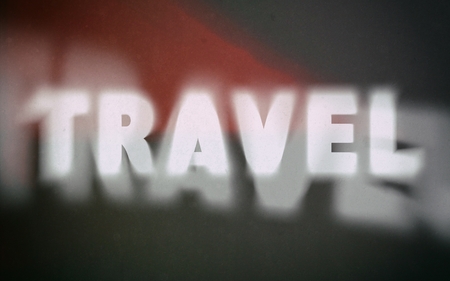 Travel word on vintage blurred background, concept signの写真素材