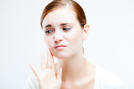 Young woman with toothache, Feeling pain toothの写真素材