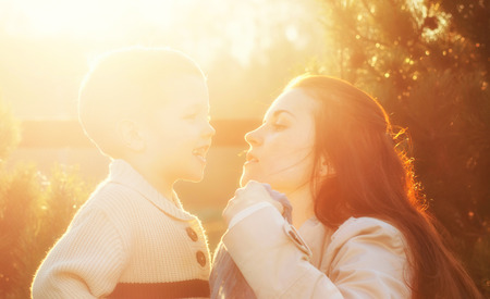 Mother and her child enjoy walk in the parkの写真素材