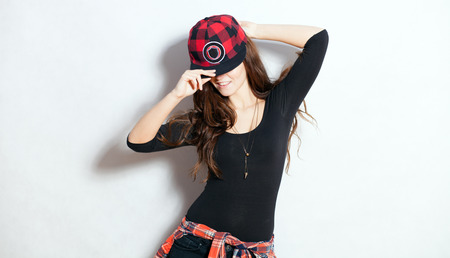 Closeup fashion studio portrait of hipster young woman