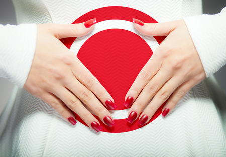 Woman having stomach ache or menstrual painの写真素材