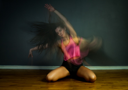 Modern hip hop dancer woman in motion blur