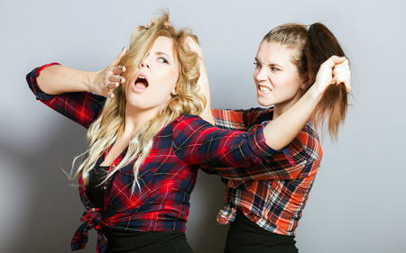 Fashion portrait of two friends posing and have fun, modern lifestyleの写真素材