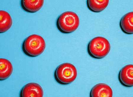 Colorful fruit pattern made of ripe red apples, eating conceptの写真素材