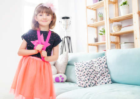 Cute little princess girl posing at homeの写真素材