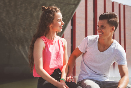 Young couple in the city talking, happiness conceptの写真素材