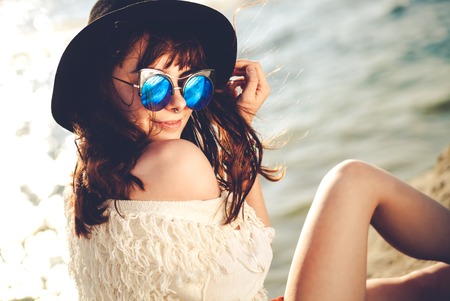 Beautiful styled hippie girl at the beach, boho fashionの写真素材