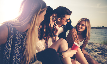 Friends having fun and enjoying beach festival party, youth concept
