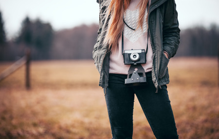 Rural scene with traveler woman with vintage cameraの写真素材