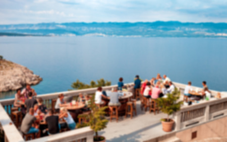 Blurred background, restaurant terrace with sea view