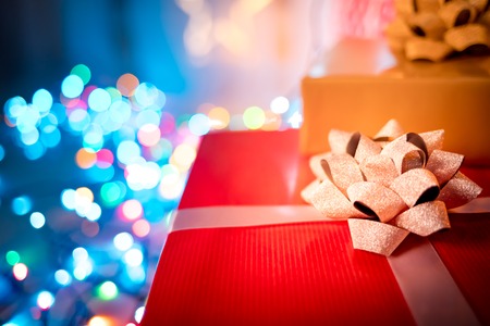 Christmas gift box next to decorations