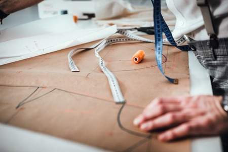 Fashion designer desk with equipment, tailoring and sewing workshop conceptの写真素材