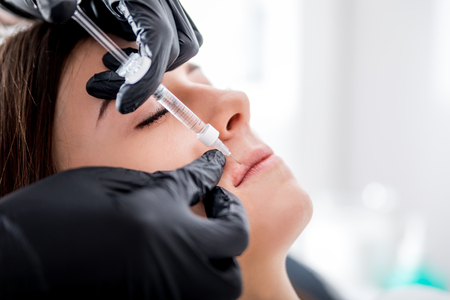 Enlarging lips at cosmetic clinicの写真素材