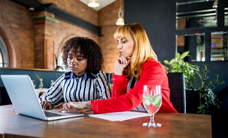 Agent show offer to client in restaurant, business talk