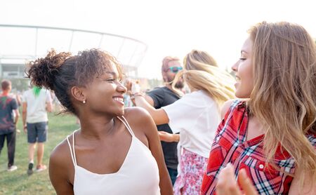 Multiethnic group of people having fun at summer music festivalの写真素材