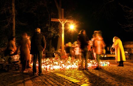 People in cemetery at All saints Dayの写真素材
