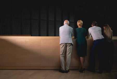 Group of business people at modern conference hall back viewの写真素材