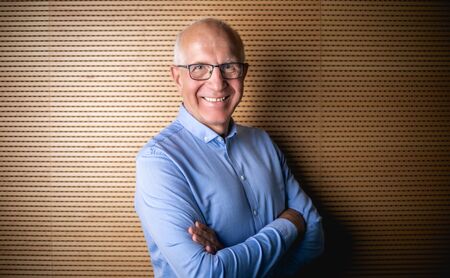Portrait of senior businessman with eyeglasses looking at cameraの写真素材