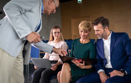 Business conference with coach questions and answersの写真素材