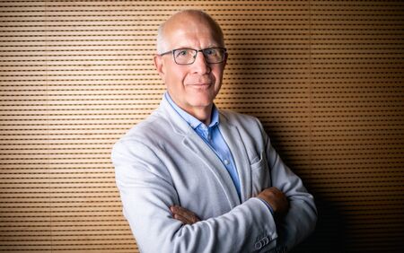 Portrait of senior businessman with eyeglasses looking at cameraの写真素材