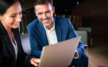 Businessman And Businesswoman Meeting In Modern Officeの写真素材