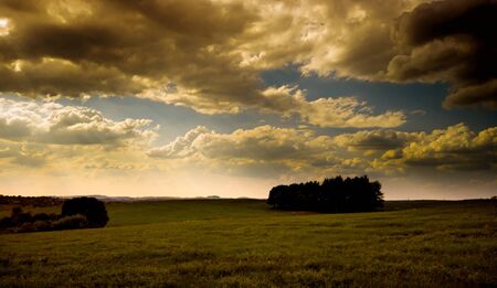 Dramatic stormy sky over rural landscapeの写真素材
