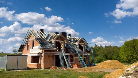 Home under construction on a building siteの写真素材